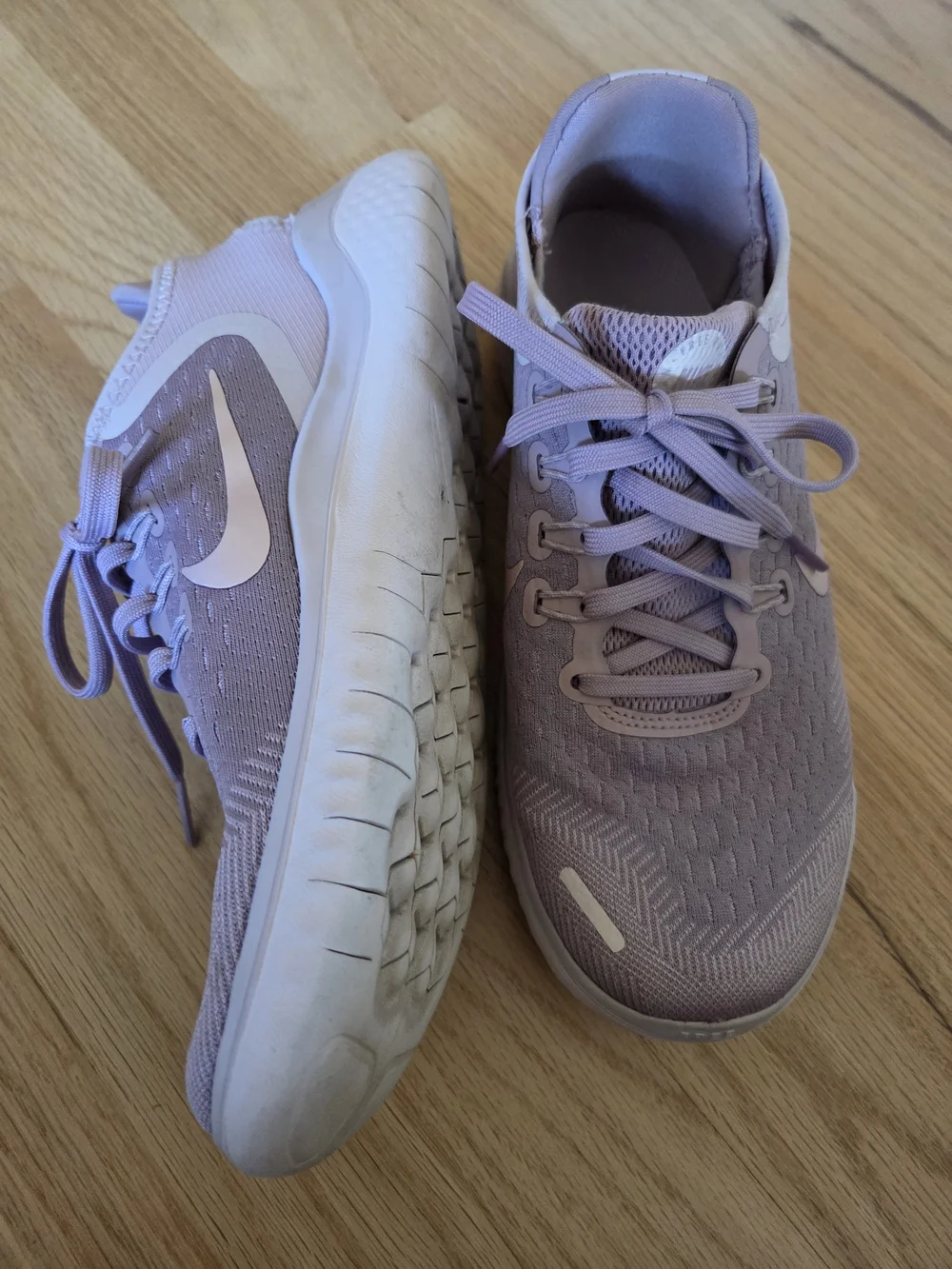 Nike Women's Pink Lilac Athletic Running Sneakers with White Swoosh